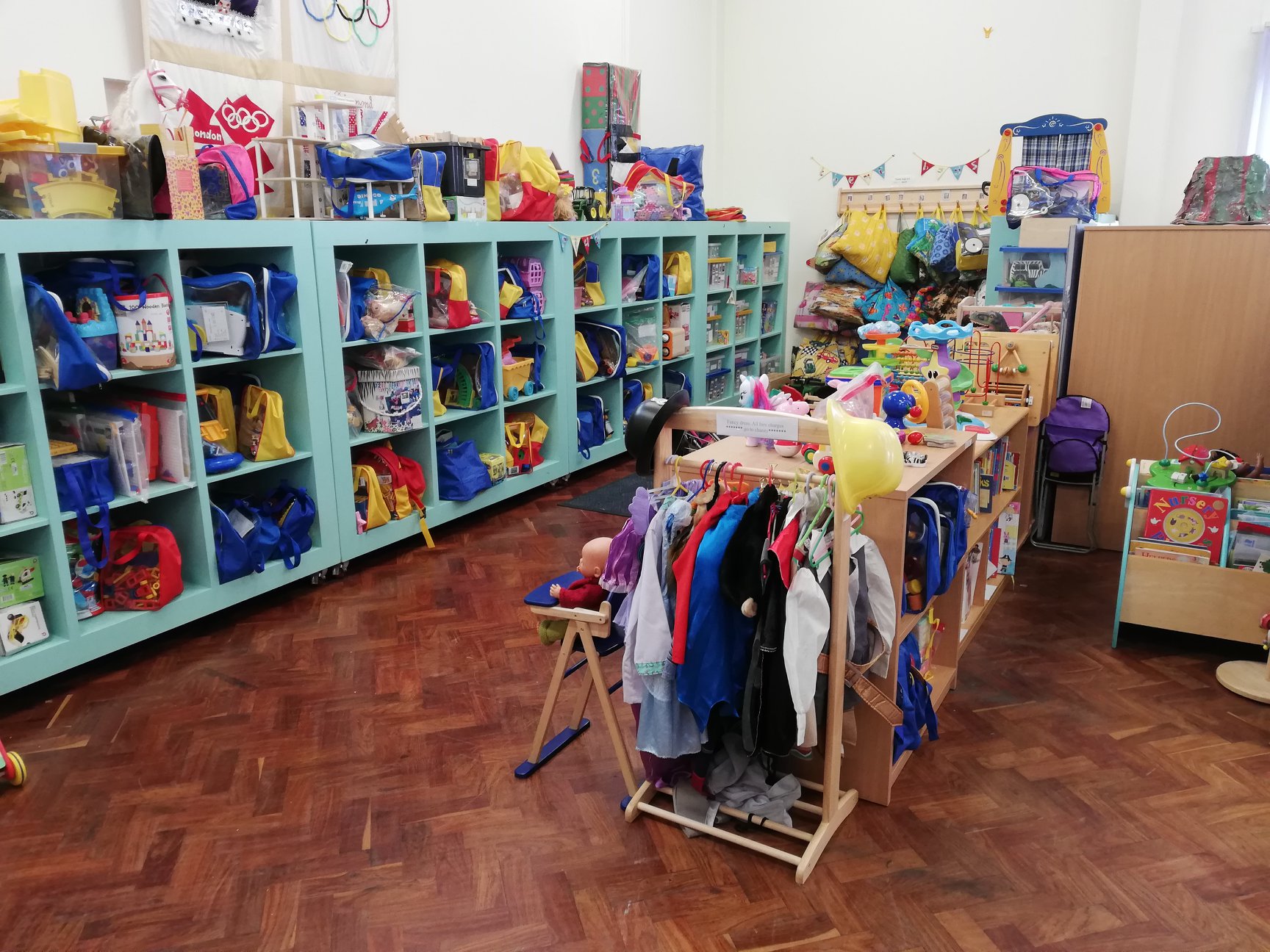 Happy family joining Camrose Toy Library for free