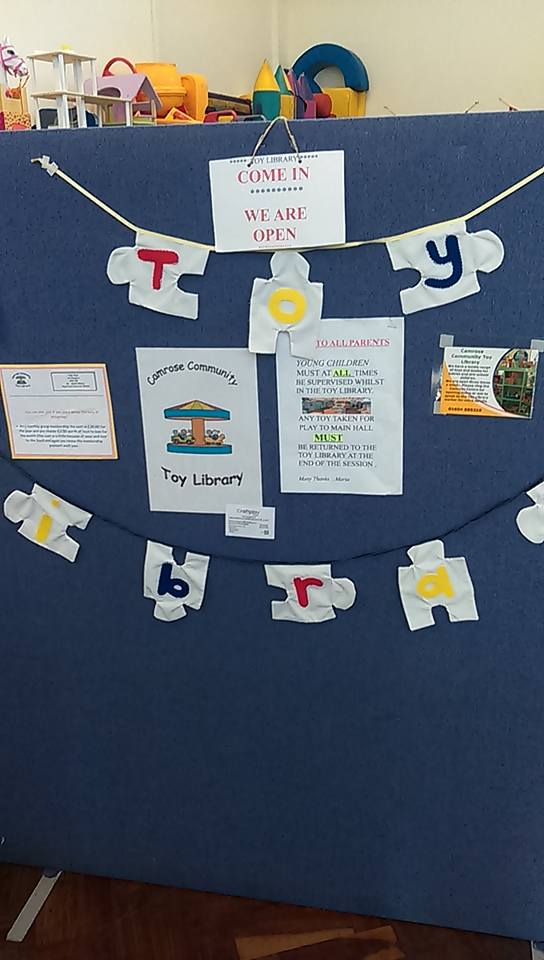 Happy children playing with educational toys at Camrose Toy Library